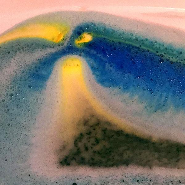 Avobath Bath Bomb dissolving in water, creating colorful swirls and fizzing action for a delightful bath bomb experience.