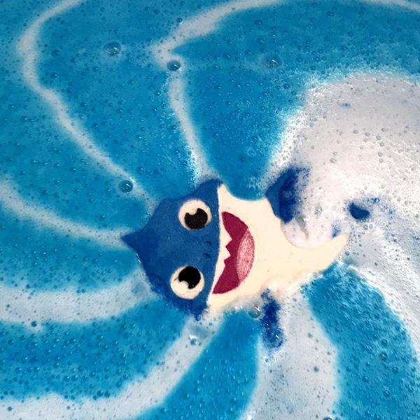 Baby Shark Bath Bomb Dissolving in Water - Experience the magic of our bath bomb as it transforms your bath into a colorful oasis