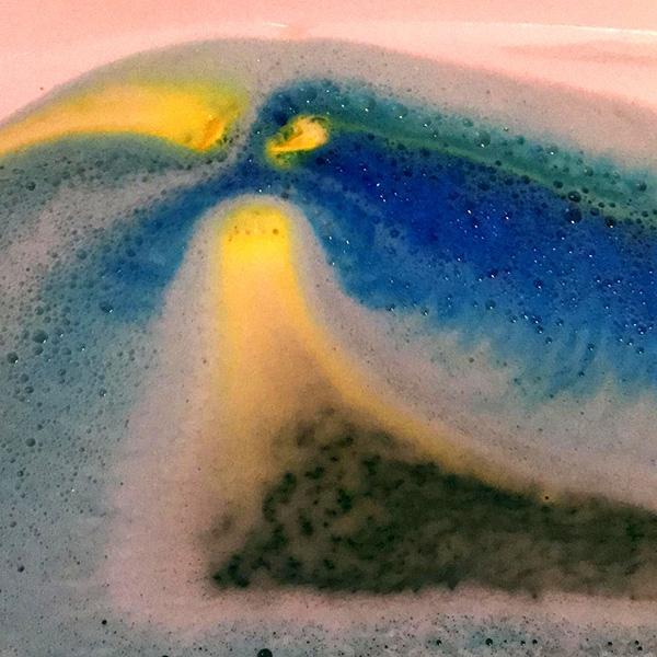 Avobath Bath Bomb dissolving in water, creating colorful swirls and fizzing action for a delightful bath bomb experience.