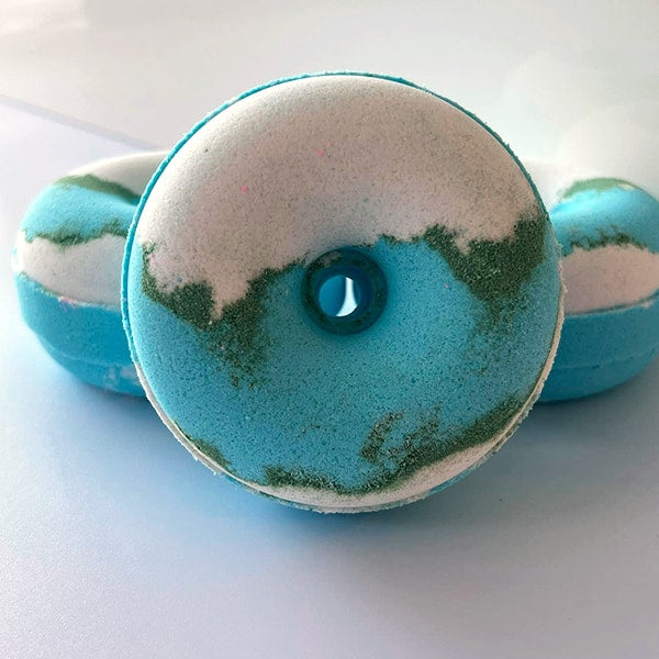 Customer Favorite Coconut Bath Bomb shaped donut on a white background