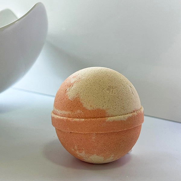 Orange and gold bath bomb - a luxurious and aromatic Chai Tea Latte experience. Transform your bath into a soothing oasis.