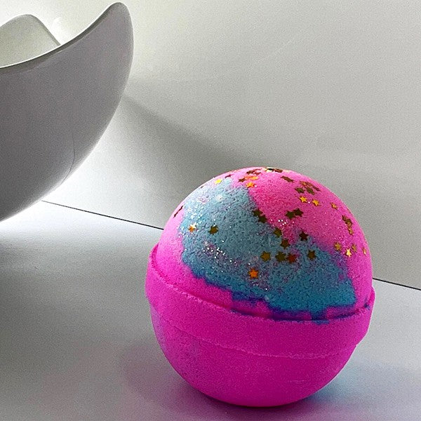 Fairy Dust Bath Bomb - Transform your bath with colors, fragrance, and shimmering star glitter for a magical experience.