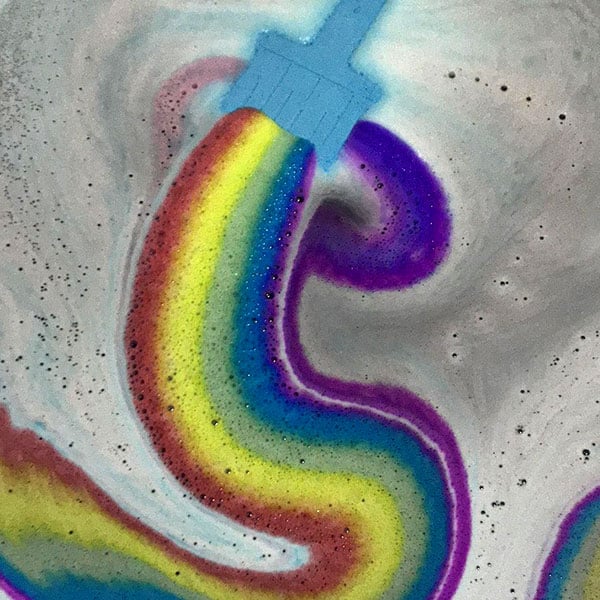 Experience the magic of our Rainbow Bath Bomb. A colorful paint brush-shaped bomb creating a stunning rainbow. Relax and enjoy!