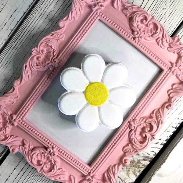 Bath bombs shaped like daisies in cheerful yellow