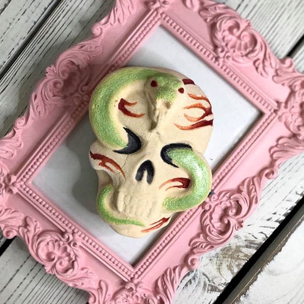 Creepy fun: Vampire Skull Bath Bomb with hidden red swirls and golden shimmer. Spooky delight for haunting baths! 